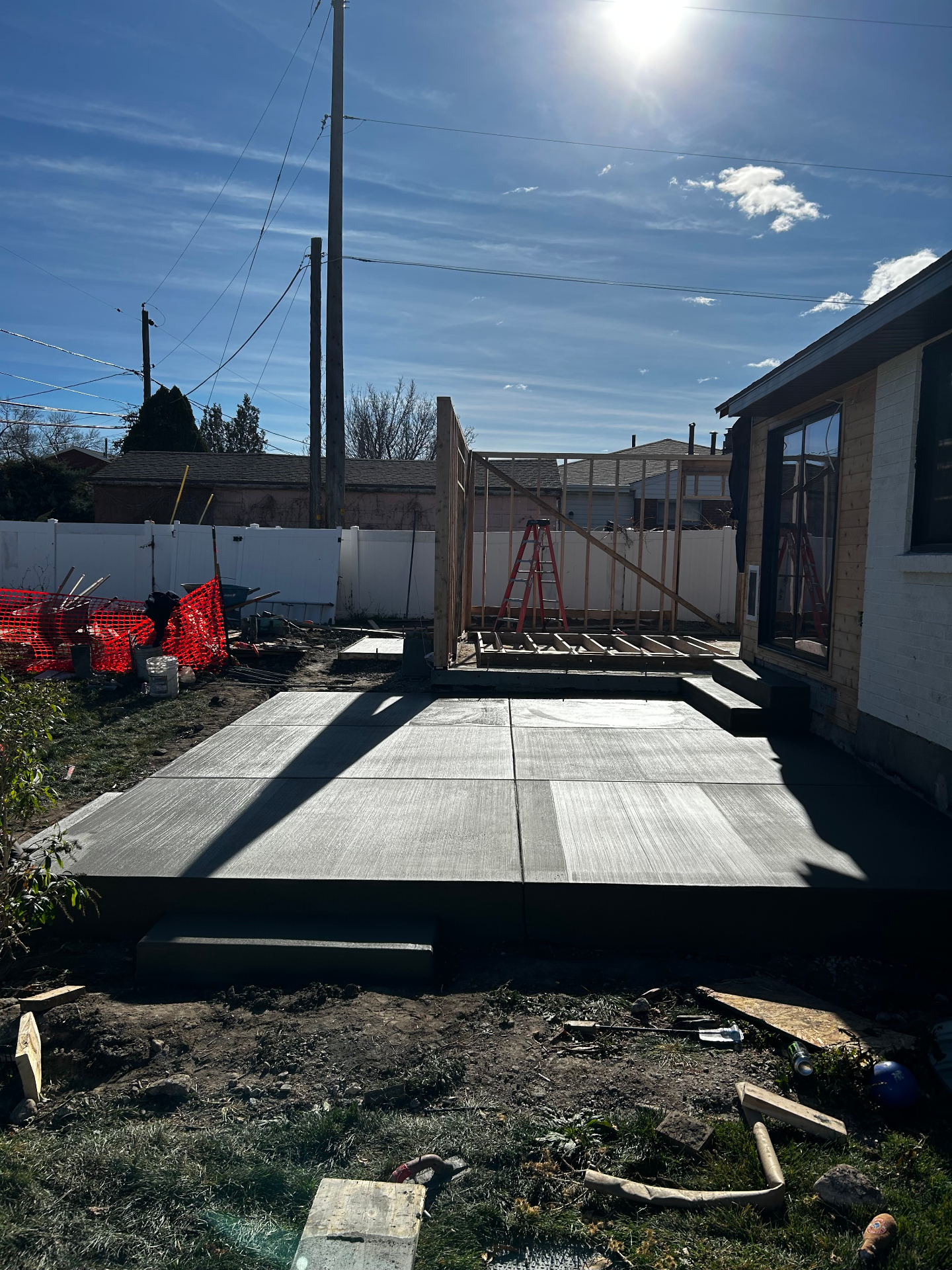 Backyard concrete patio with broom finish in Salt Lake City