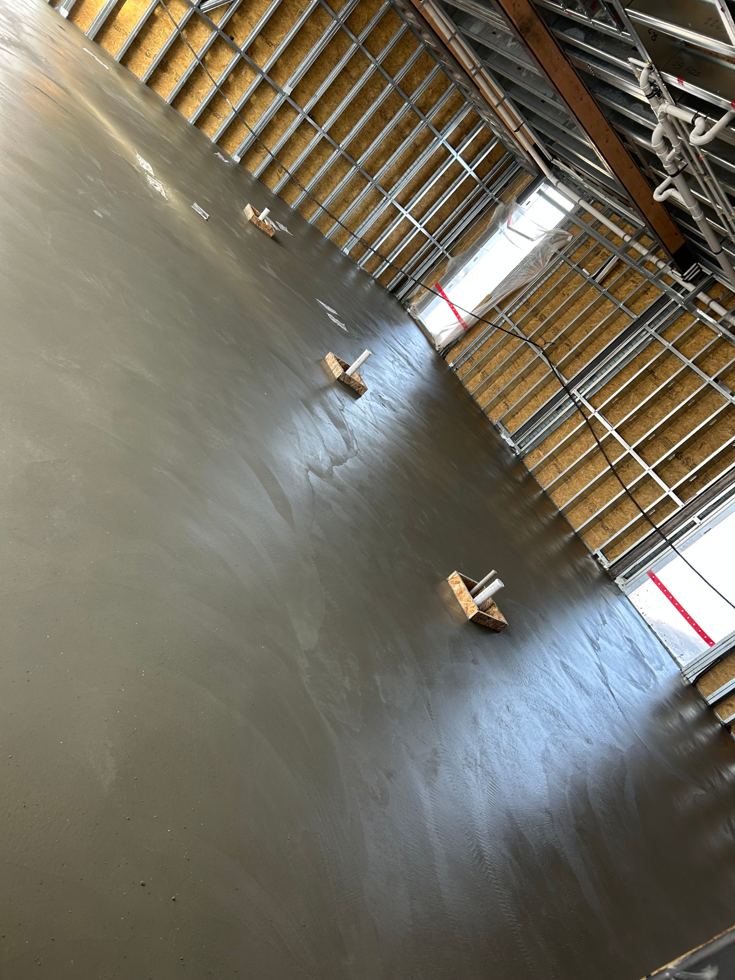 Smooth troweled commercial concrete floor inside new build