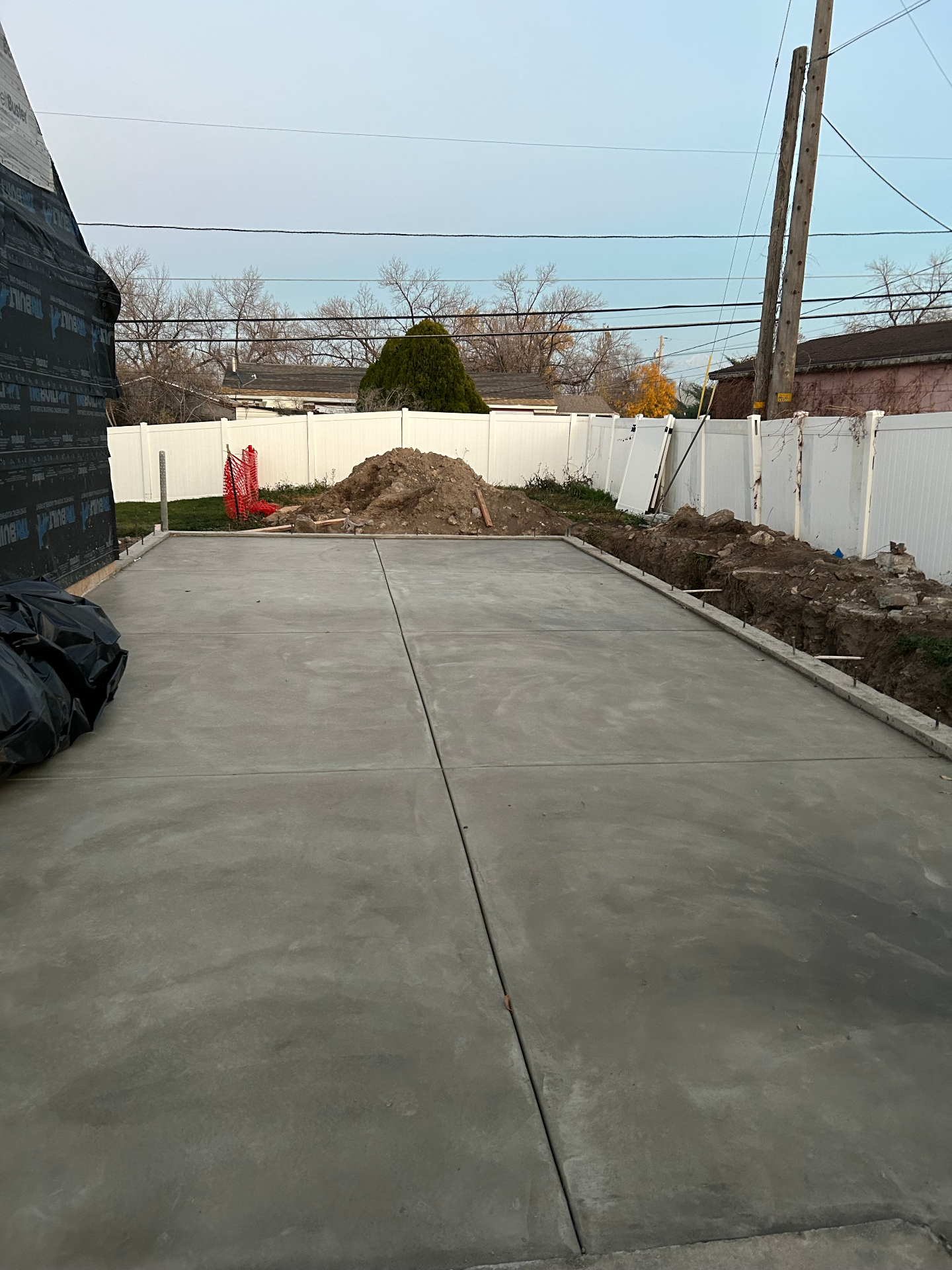 Finished concrete garage pad in Salt Lake City backyard